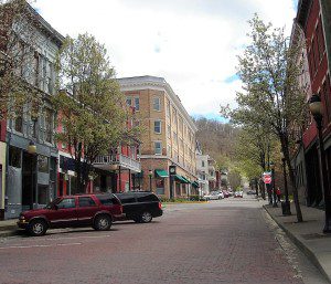 A street with cars parked on the side of it.